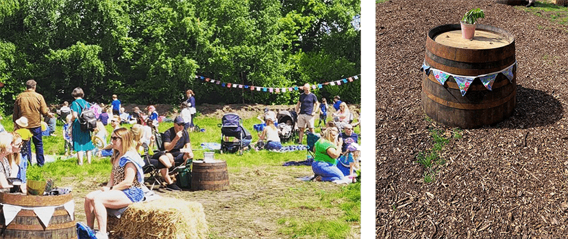  people at Buzzfest 2022 in Lanarkshire, reclaimed whisky barrel table with plant